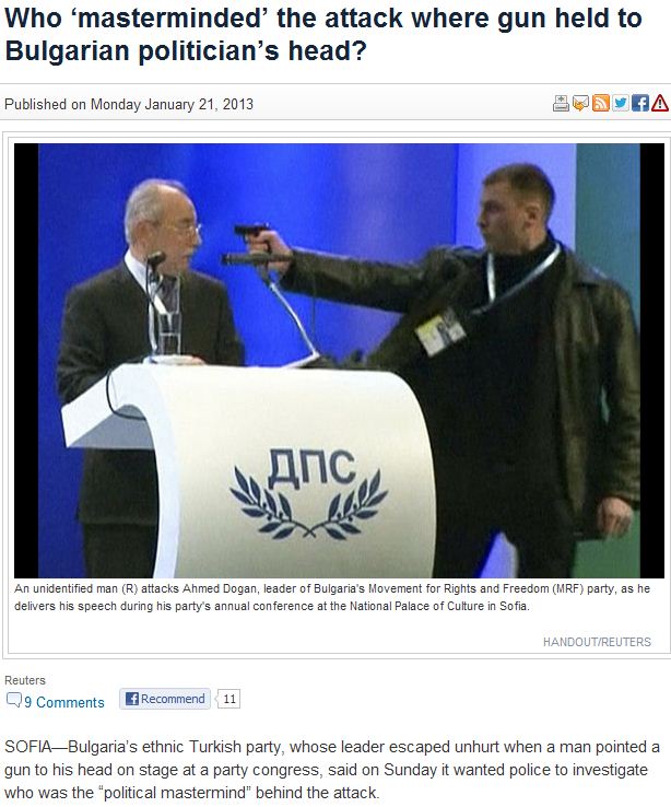 muslim crazy man with toygun on stage with muslim politician 22.1.2013