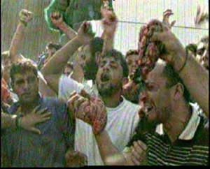 arabs.waving.entrails.butchered.israelis.ramallah