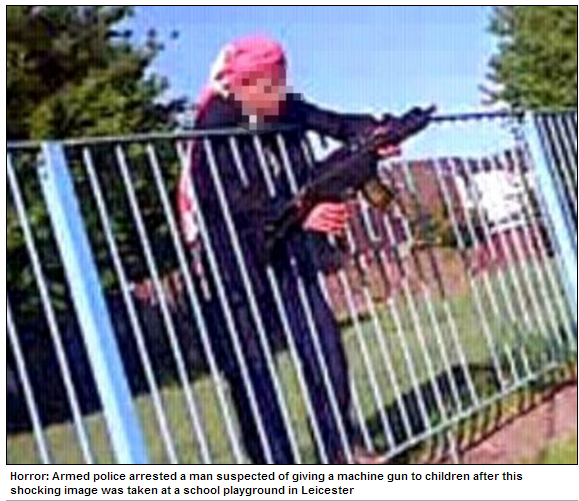 tard hands machine gun to kid at school playground 9.6.2013