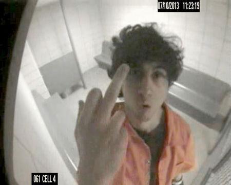 Dzhokhar Tsarnaev gestures towards a surveillance camera in his holding cell in this 2013 surveillance image released by the U.S. Justice department. REUTERS/USDOJ