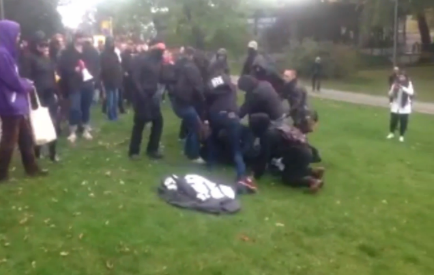 antifa black shirts attacks man filming their protest.
